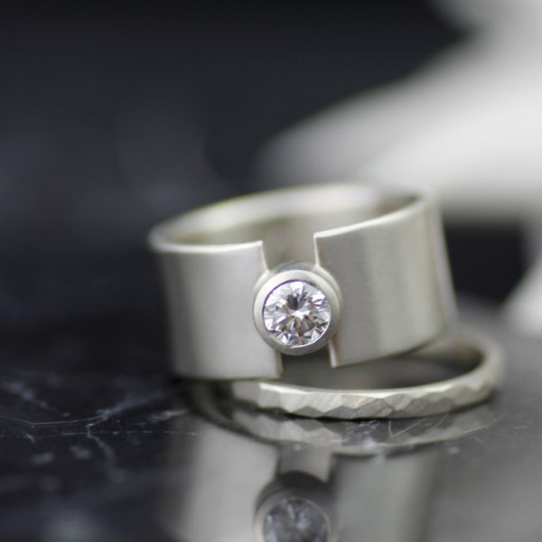 allKwhitegoldmoissanitelunareclipsewidemodernengagmentringwithfacetedweddingband scaled