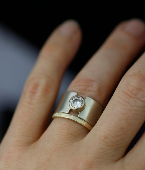 lunareclipsewhiteandyellowgoldwidebandweddingringonhand