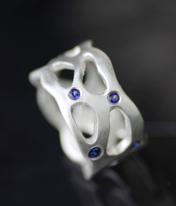 nebulawidebandweddingringwithbluesapphiresmain scaled