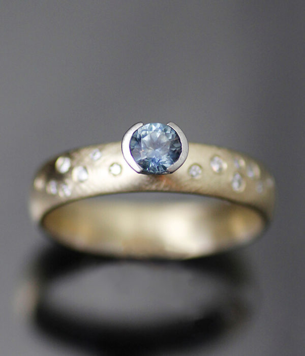 montana sapphire K gold with side diamonds black