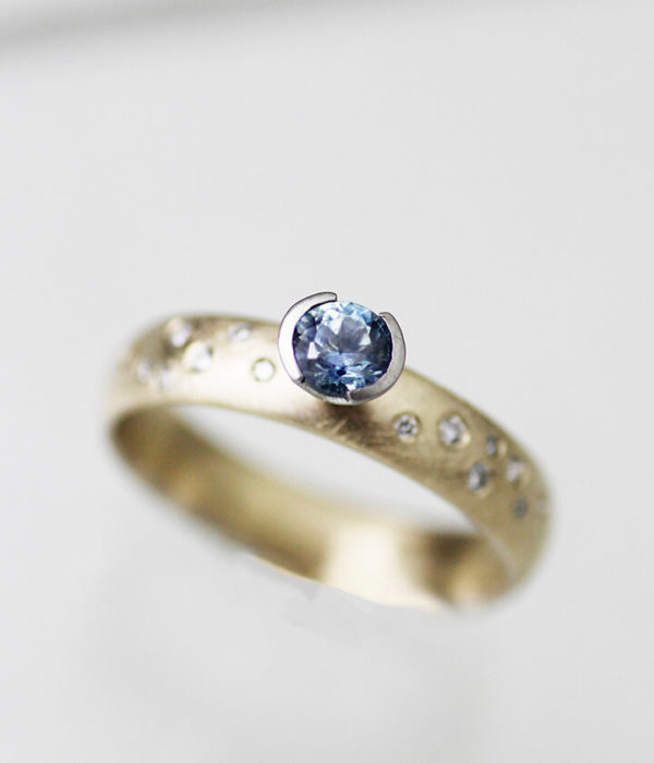 montana sapphire K gold with side diamonds