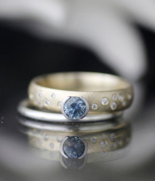 montana sapphire K gold with side diamonds set