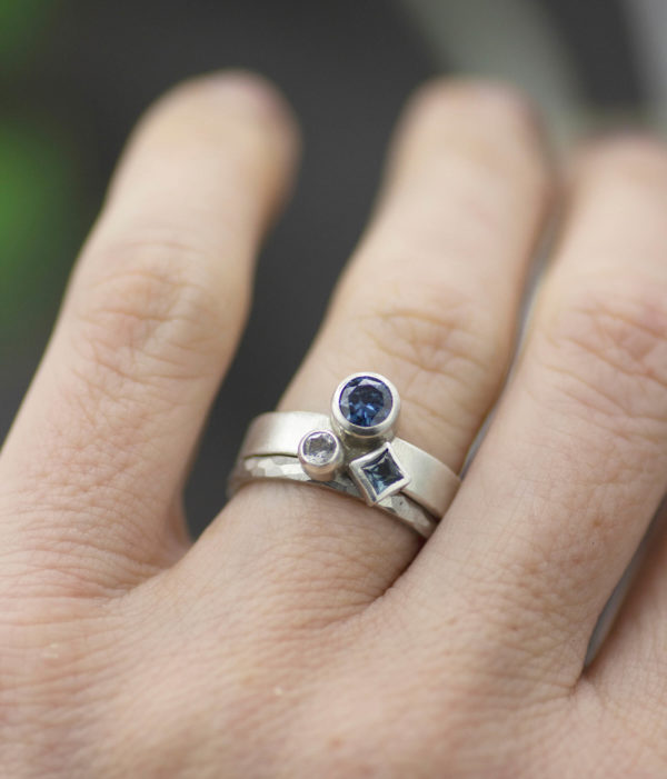 blue ice storm ring on hand