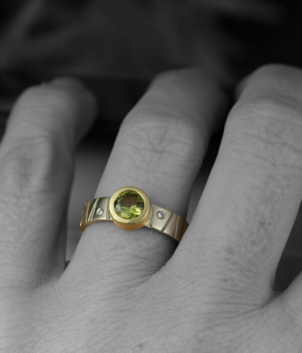 green sapphire diamond bark band on hand