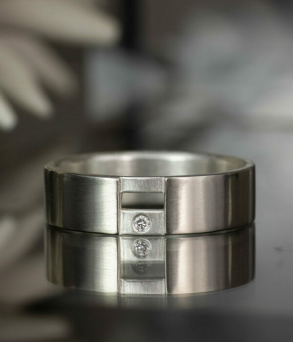 white gold and silver gap ring with diamond