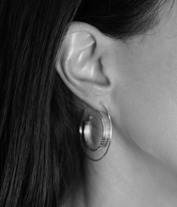 textured backward loop hoops  on model