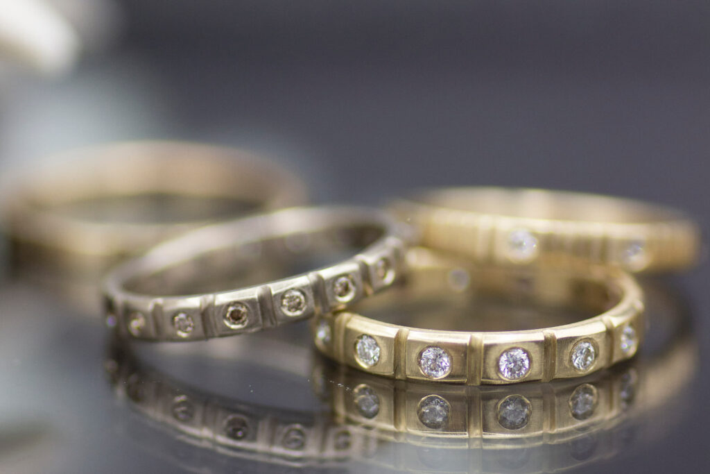 14k gold and palladium white gold crenelated lab grown diamond eternity wedding bands