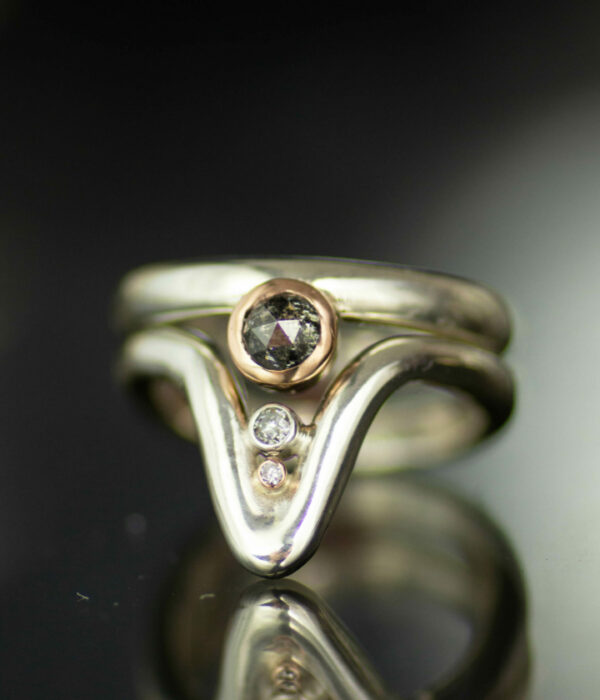deep wave salt and pepper bezel set rose cut diamond platinum and 14K rose gold contemporary wedding set with tiny diamonds