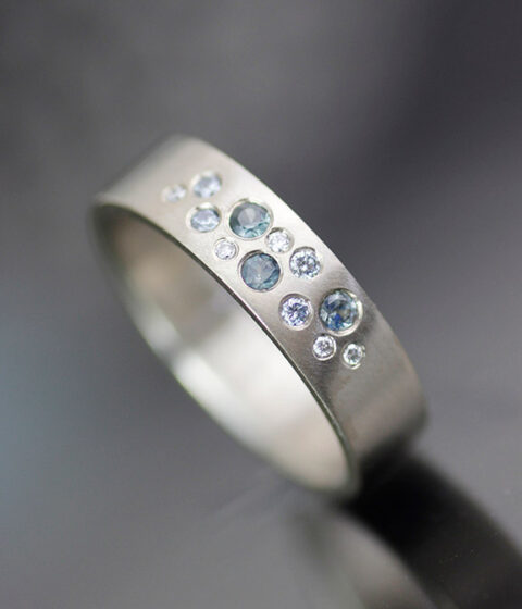 blue lagoon montana sapphire and lab grown diamond gender neutral wedding band